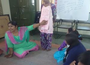 Santosh Ji, our resource person facilitating the girls to understand menstruation cycle.